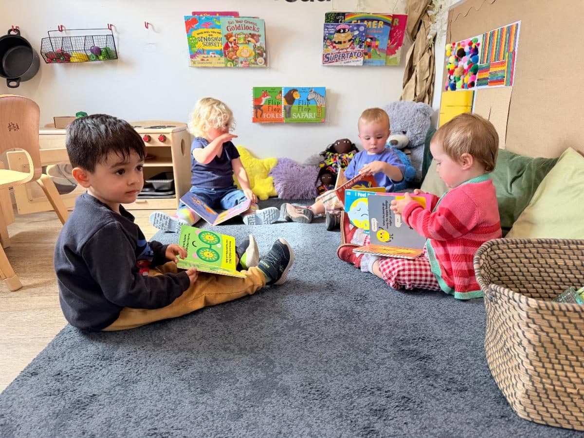 Unique child montessori children reading books together