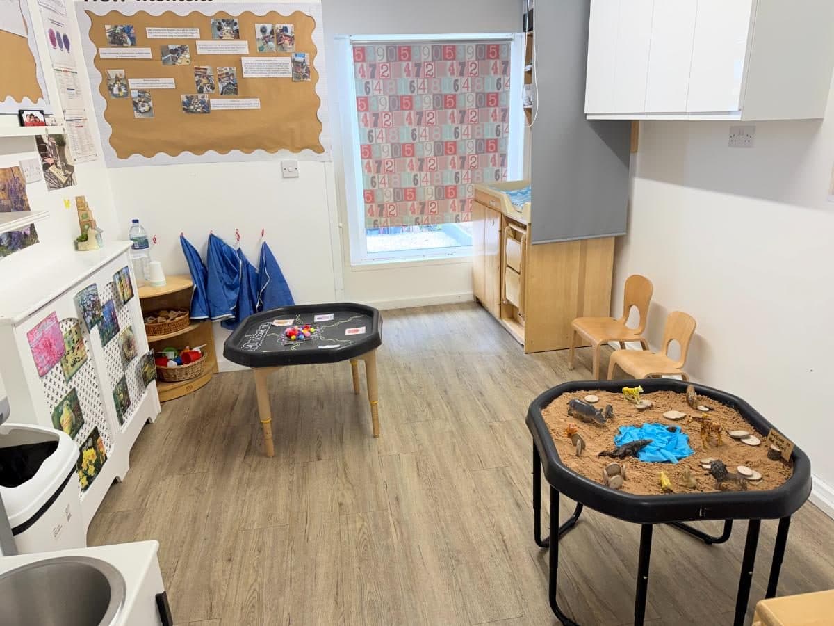 Sensory exploration with sand and natural materials at Unique Child Montessori Higham Hill