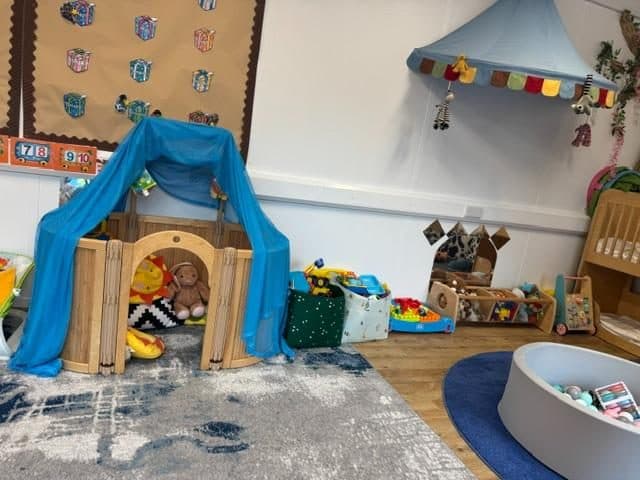 Blue play tent in the northolt nursery at unique child montessori